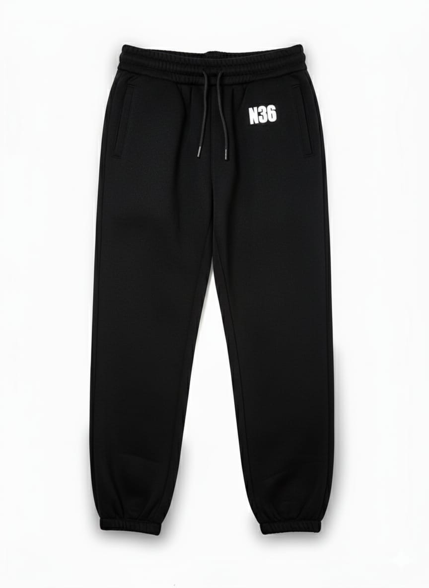 N36 unisex black trackpants with white thigh logo, elastic waistband and drawstring